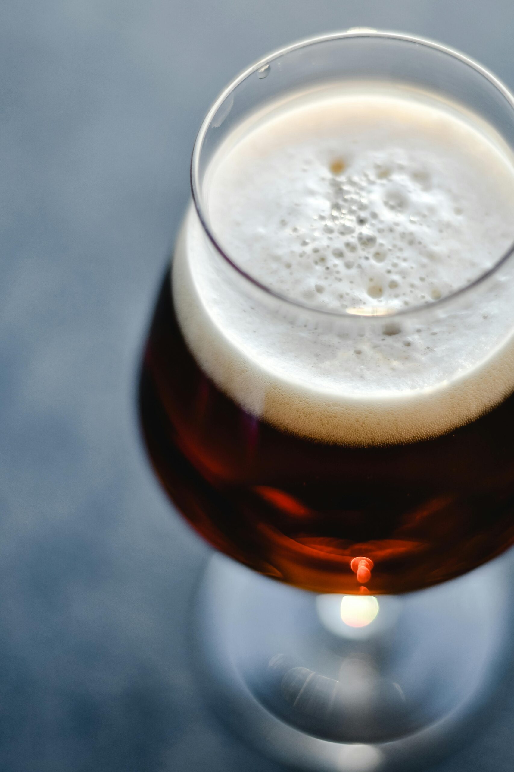 Close-up of a beer glass with perfect foamy head