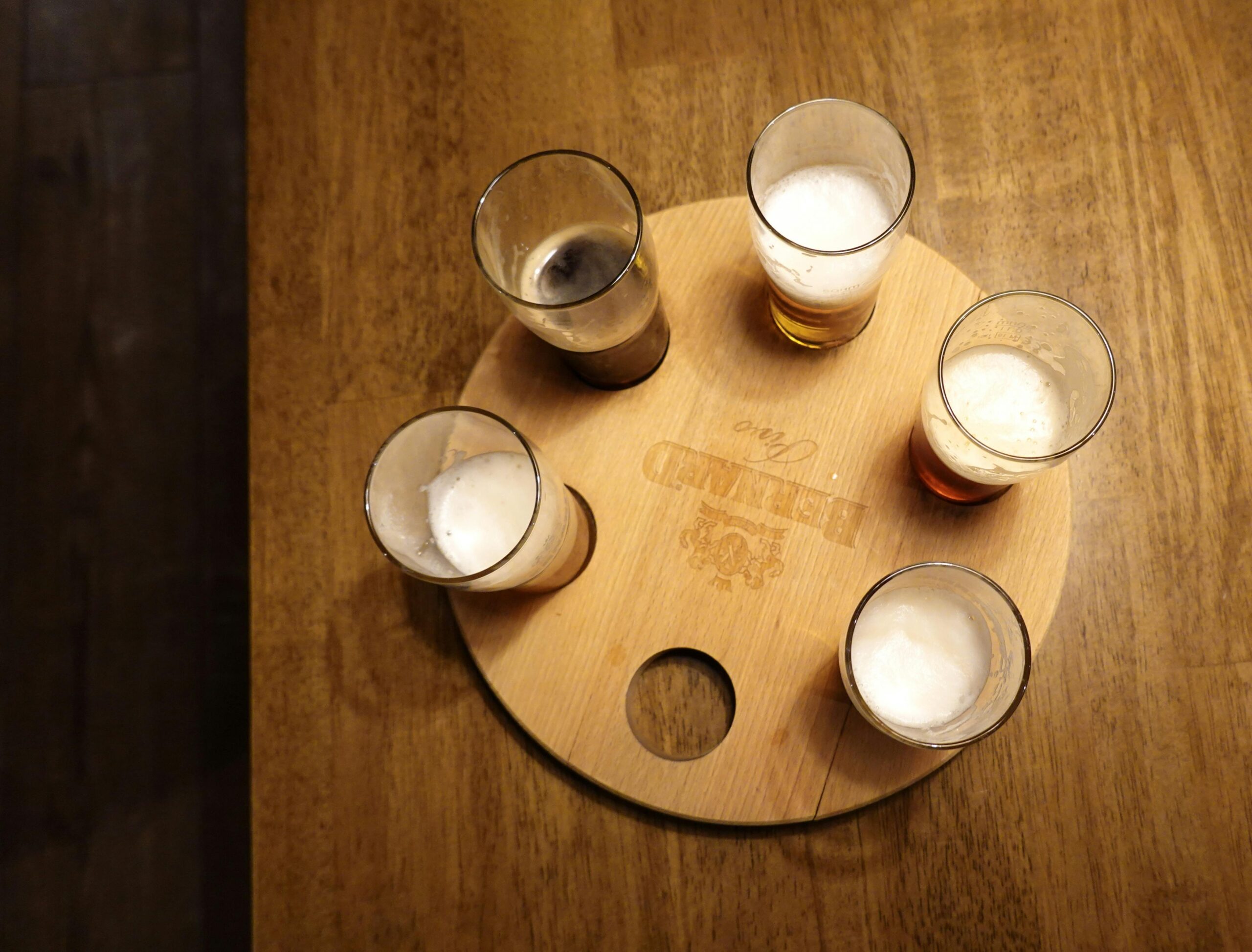 A flight of different beer styles arranged for tasting