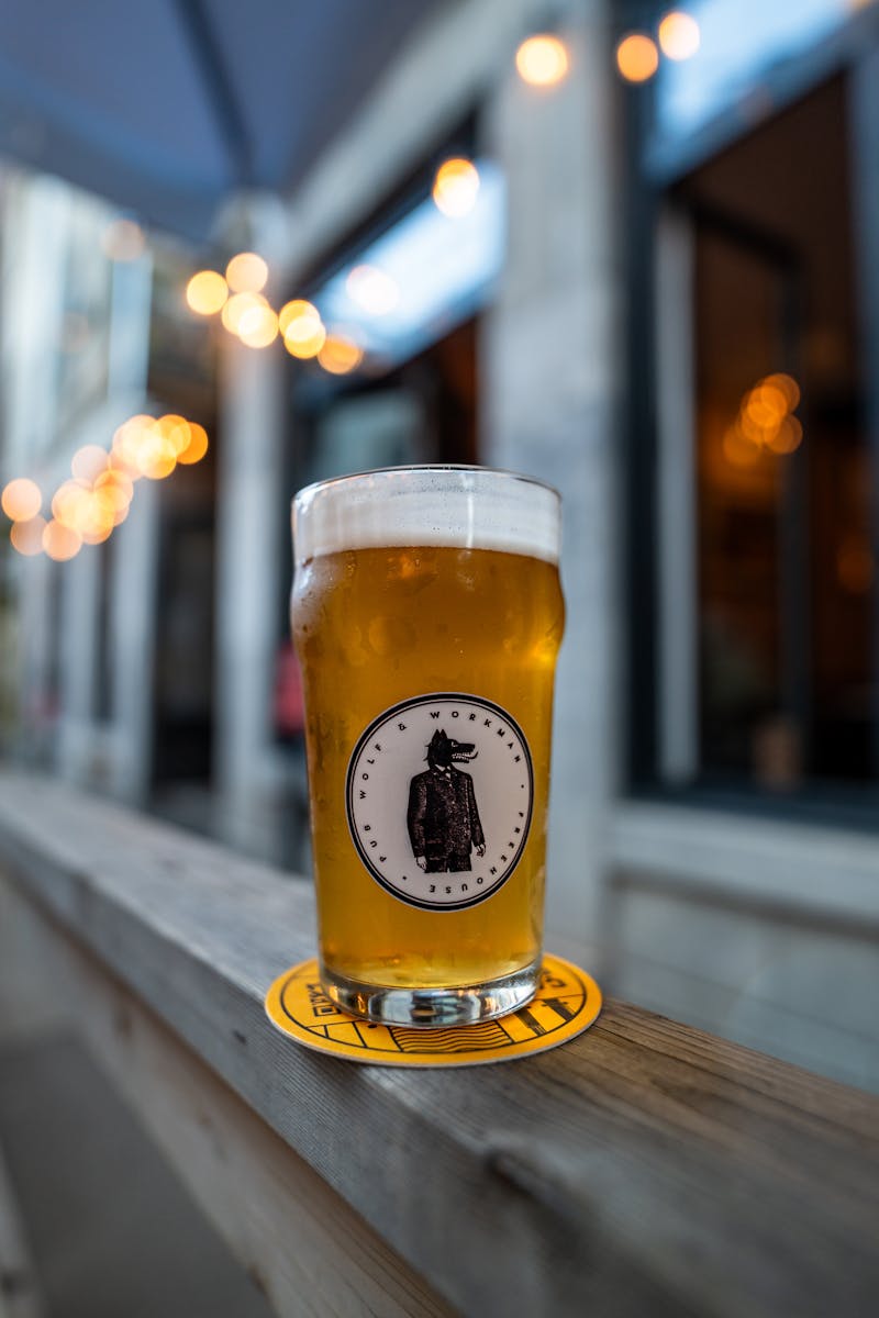 Pint of golden craft beer on an outdoor patio