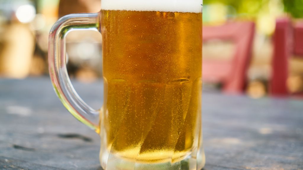 Cold homebrew beer being transferred into a sealed corny keg